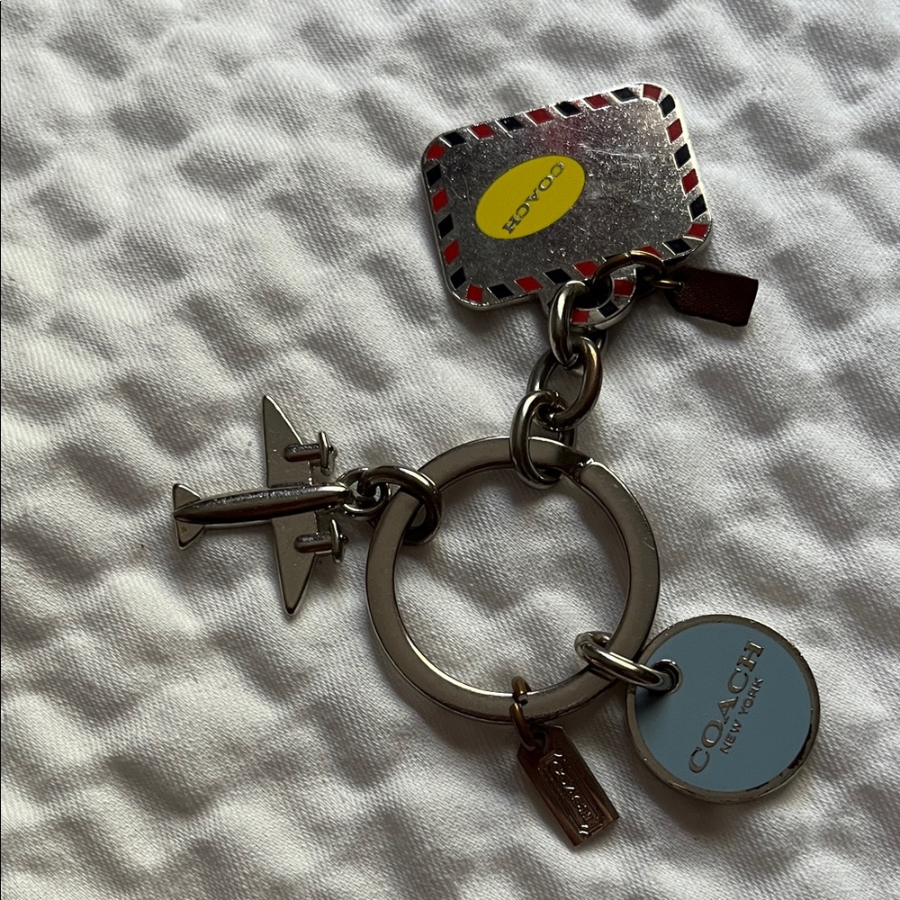 Coach Silver and Blue Airplane Keychain